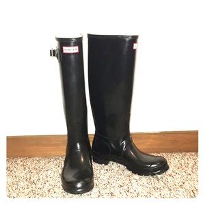 Tall Black Hunter rain boots.